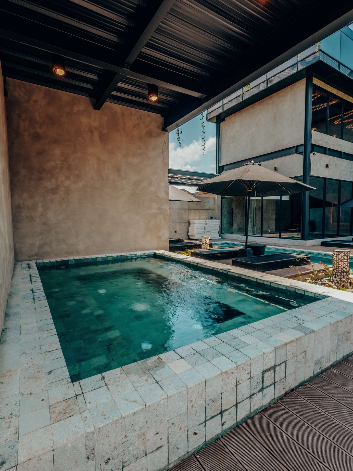 Stone-tiled plunge pool on the terrace at The Compound