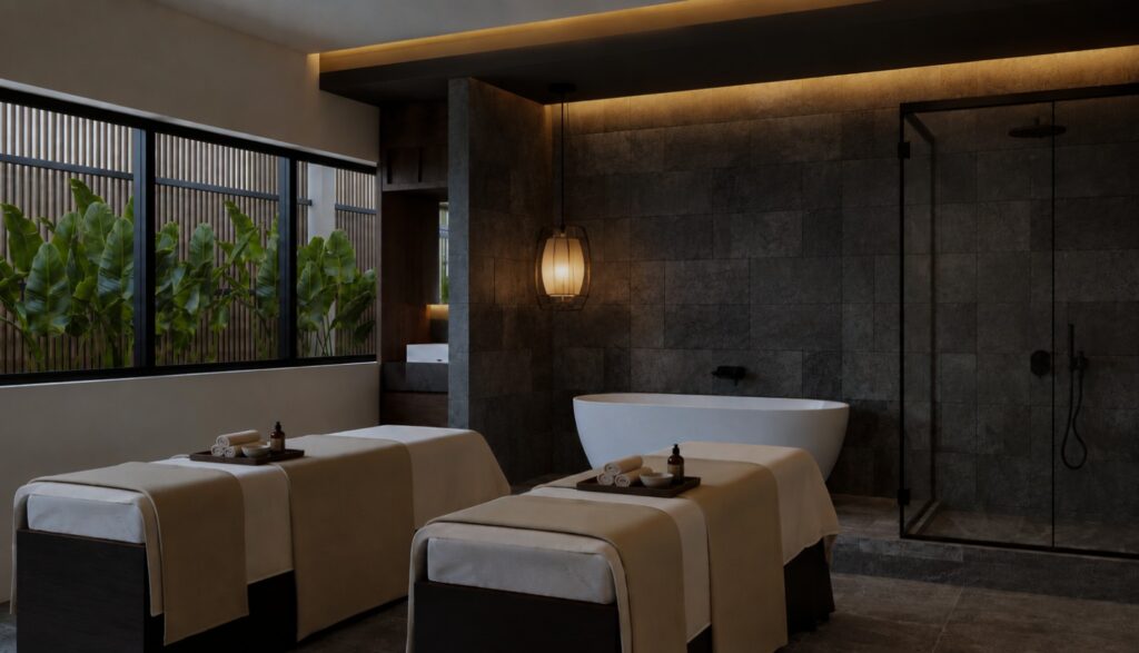 Twin massage beds and a freestanding bathtub in an Onyx Spa treatment room