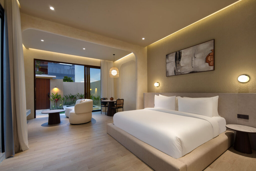 Bedroom of a one-bedroom pool villa, king bed facing the garden